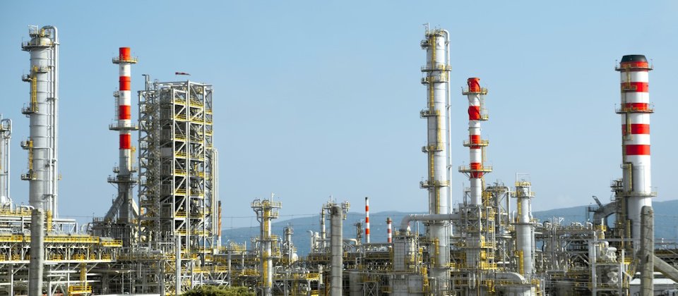 Photo by <a href="https://unsplash.com/@c7arb?utm_source=unsplash&utm_medium=referral&utm_content=creditCopyText">Christian Harb</a> on <a href="https://unsplash.com/photos/a-factory-with-a-lot-of-red-and-white-pipes-76yzygeNLT0?utm_source=unsplash&utm_medium=referral&utm_content=creditCopyText">Unsplash</a>